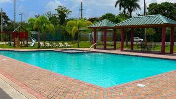 Outdoor pool, pool umbrellas, sun loungers