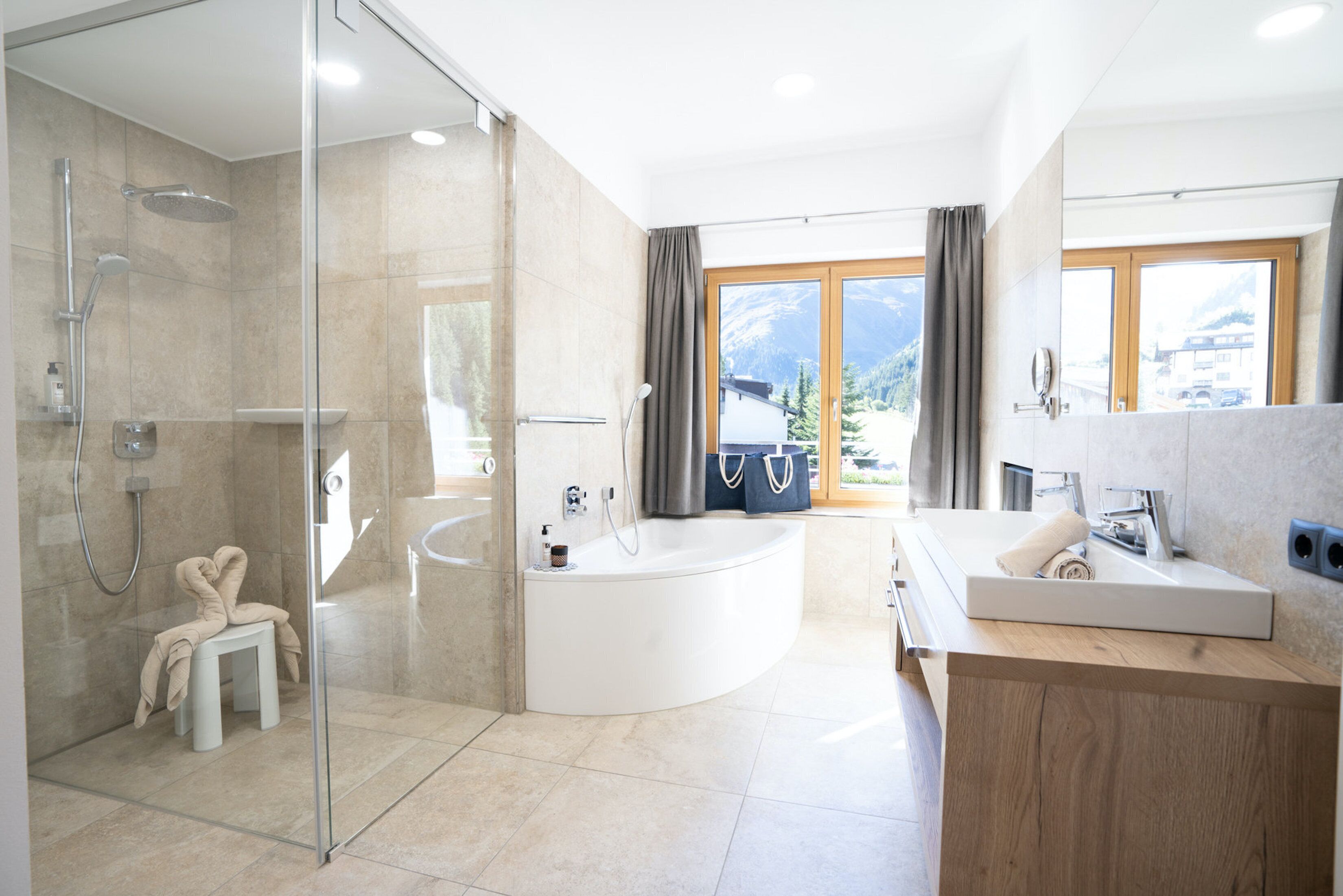 panoramic studio suite (tirol) | bathroom | shower, rainfall showerhead, free toiletries, hair dryer