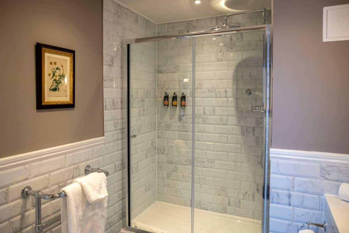 Shower, designer toiletries, hair dryer, bathrobes