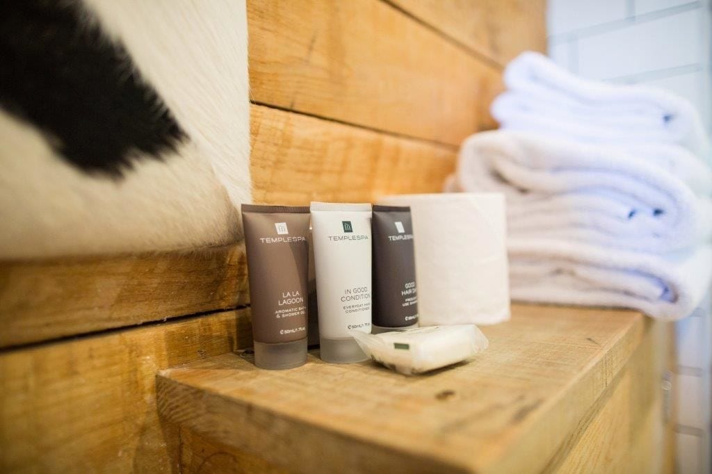 shower, designer toiletries, hair dryer, towels