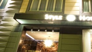 A hotel entrance with a sign that reads "Style Hotel." - Style Hotel (Milan)