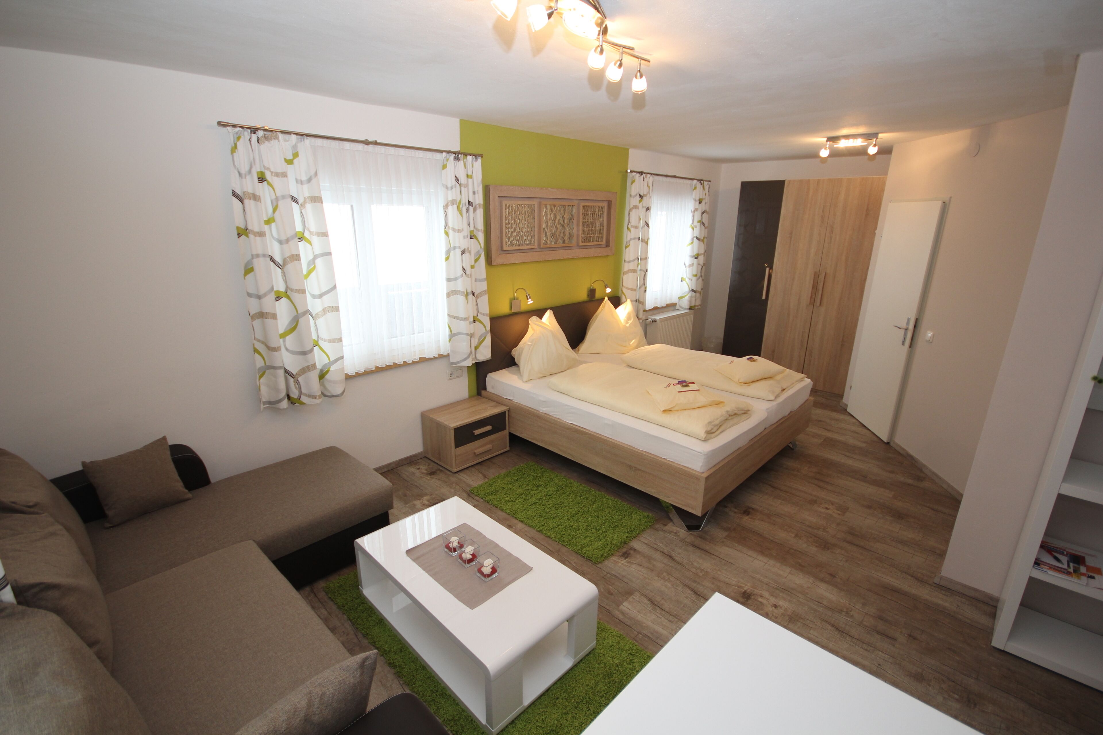 deluxe double room, mountain view | living area | lcd tv