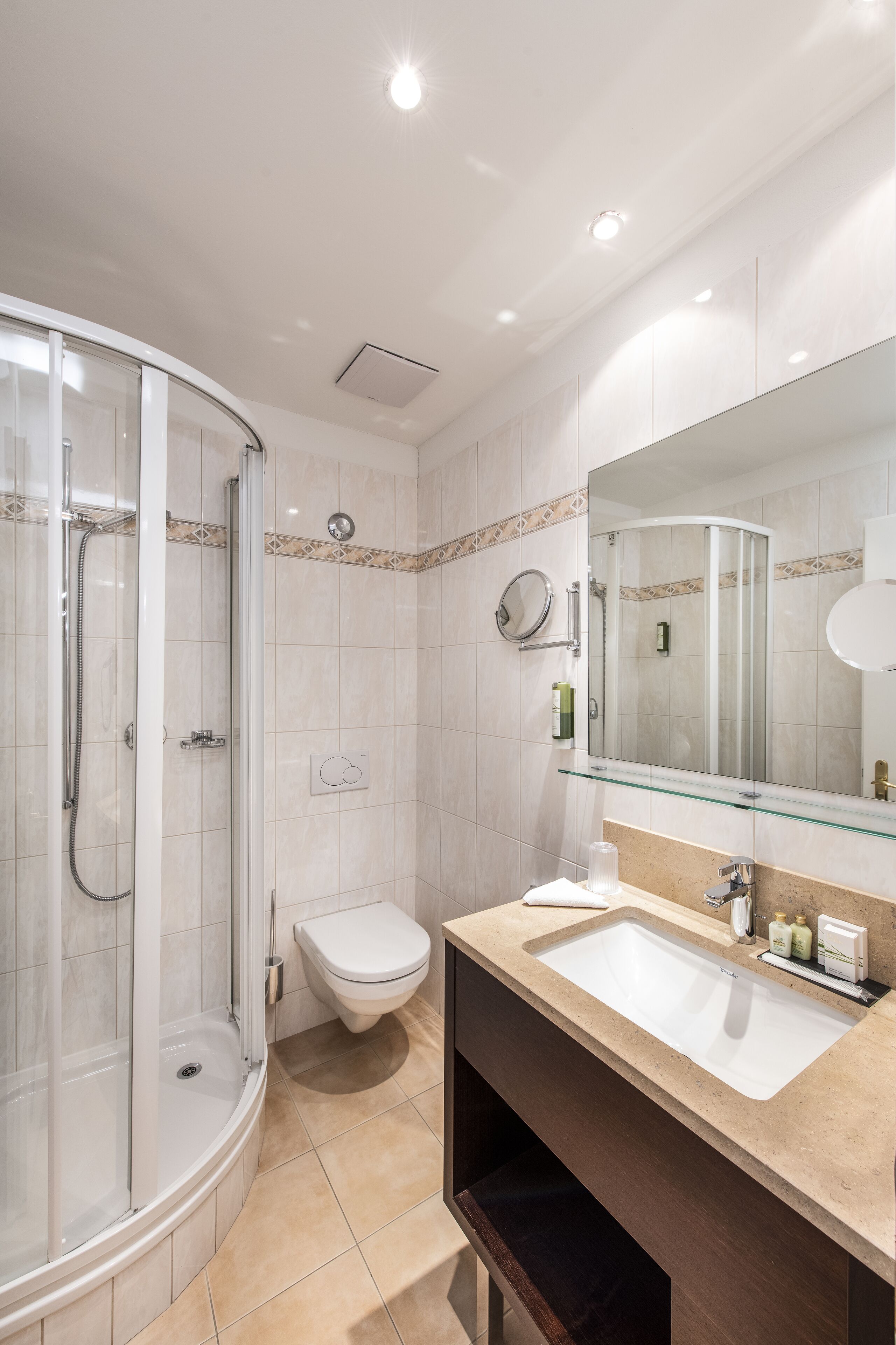 comfort single room | bathroom | rainfall showerhead, designer toiletries, hair dryer, dressing gowns