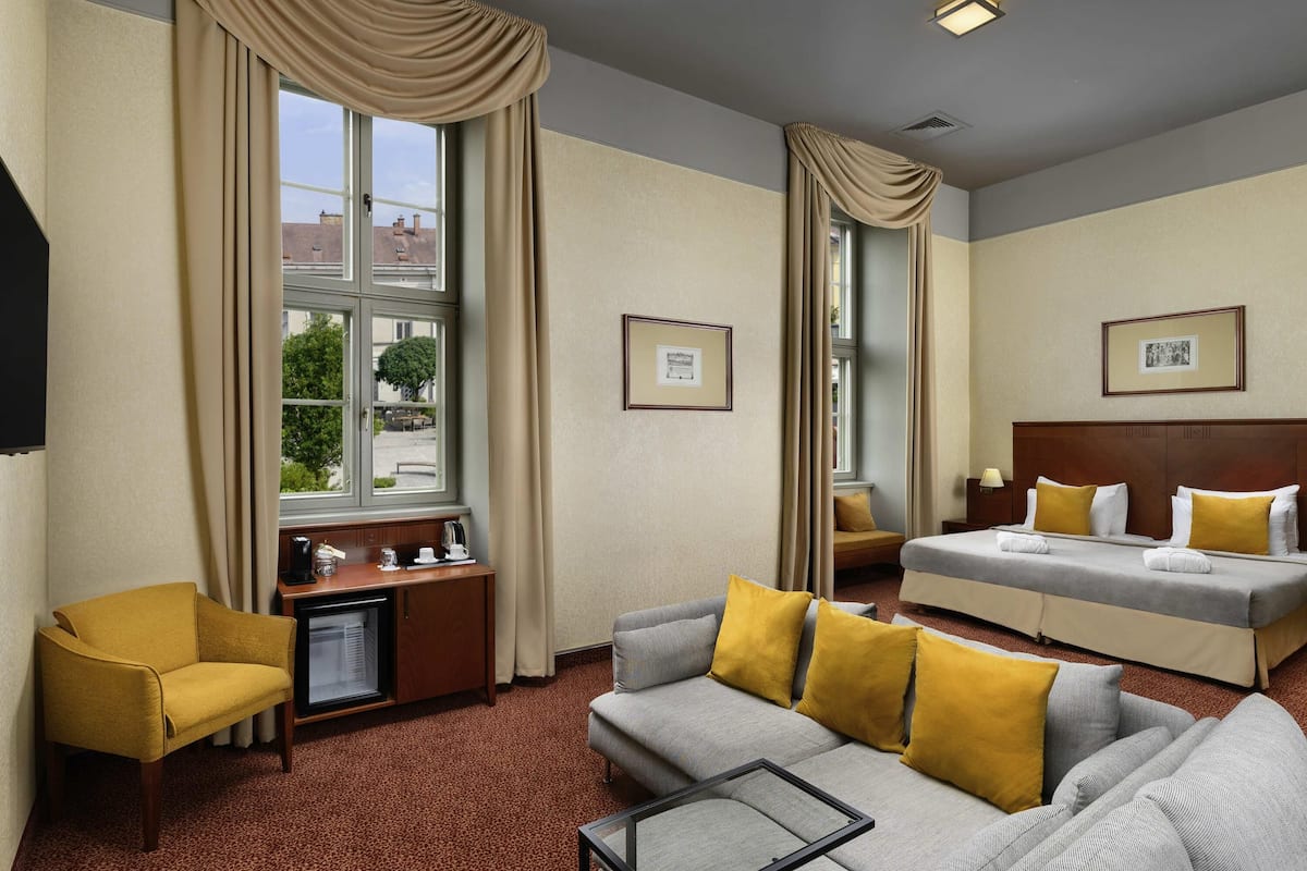 Junior Suite, Multiple Beds | In-room safe, desk, laptop workspace, blackout drapes