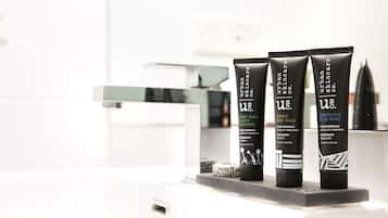 Three tubes of Urban Skincare products on a bathroom counter.