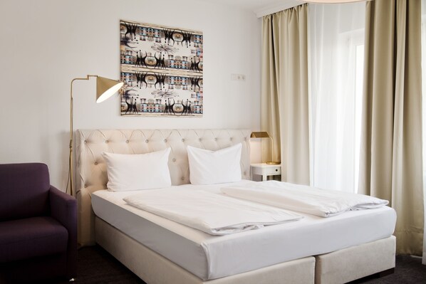 Hypo-allergenic bedding, minibar, in-room safe, iron/ironing board