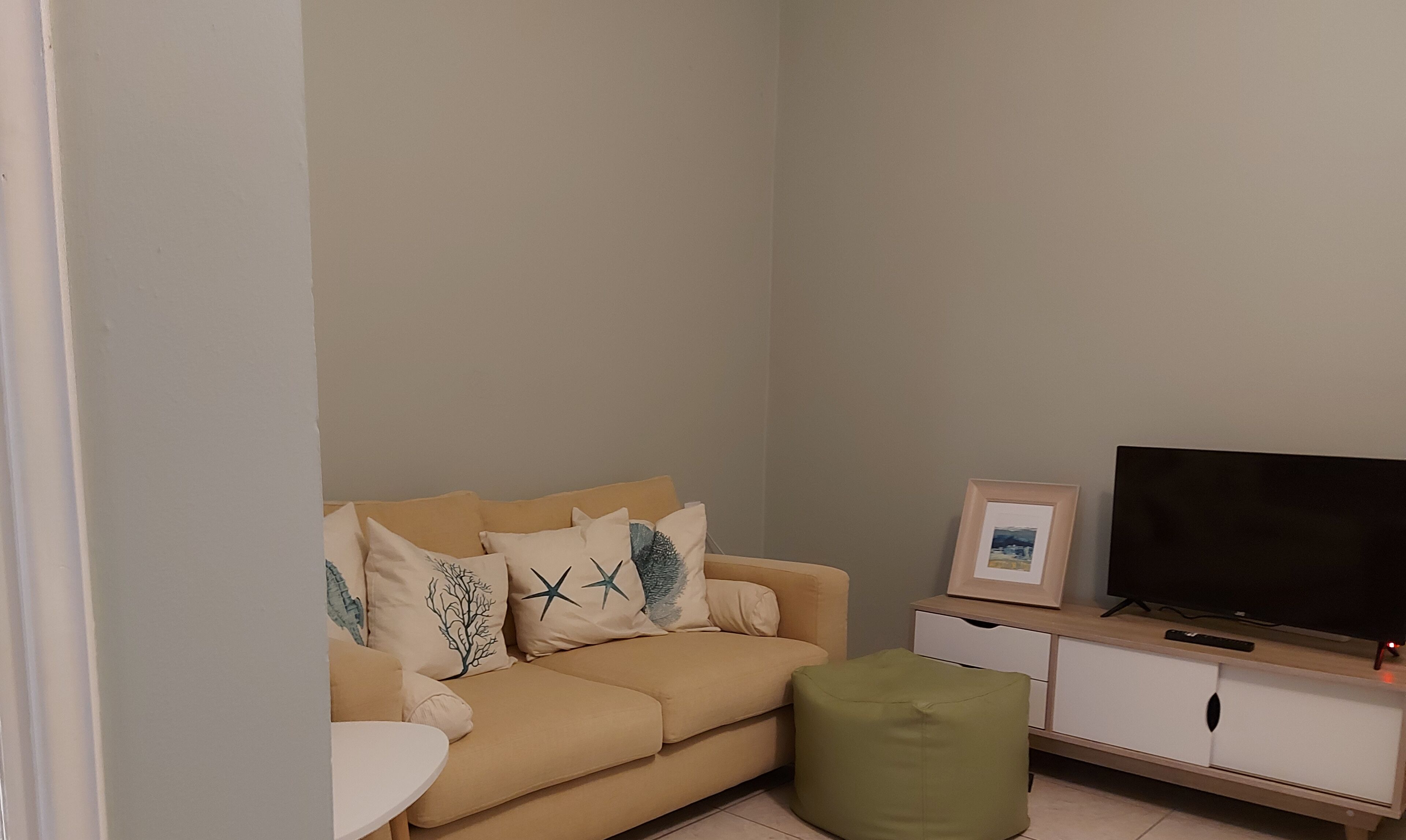 one bedroom apartment for 2 | living area | 32-inch smart tv with digital channels, tv