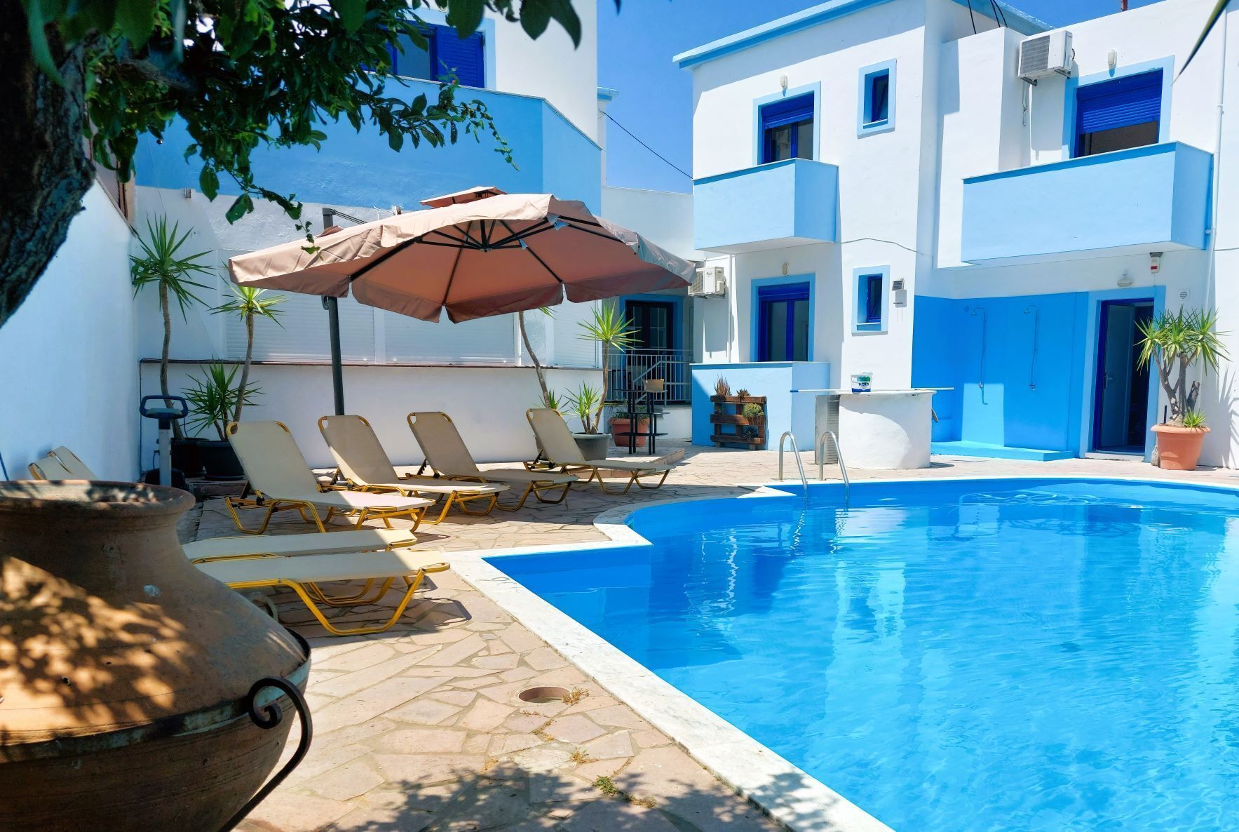 seasonal outdoor pool, pool umbrellas, pool loungers