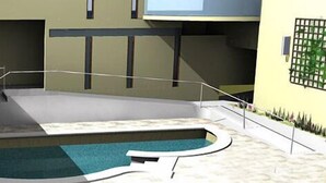 Un área de piscina interior moderna con una piscina curva, una escalera y una barandilla.