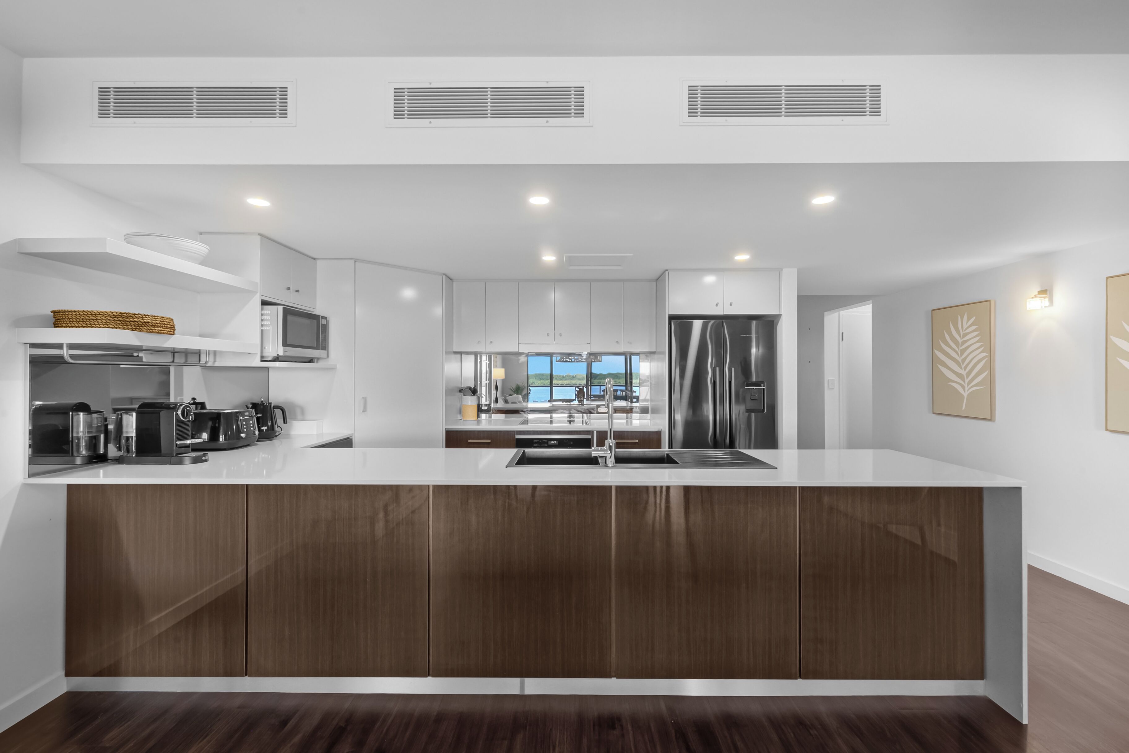 Deluxe Two Bedroom Apartment | Private kitchen | Full-size fridge, microwave, oven, coffee/tea maker