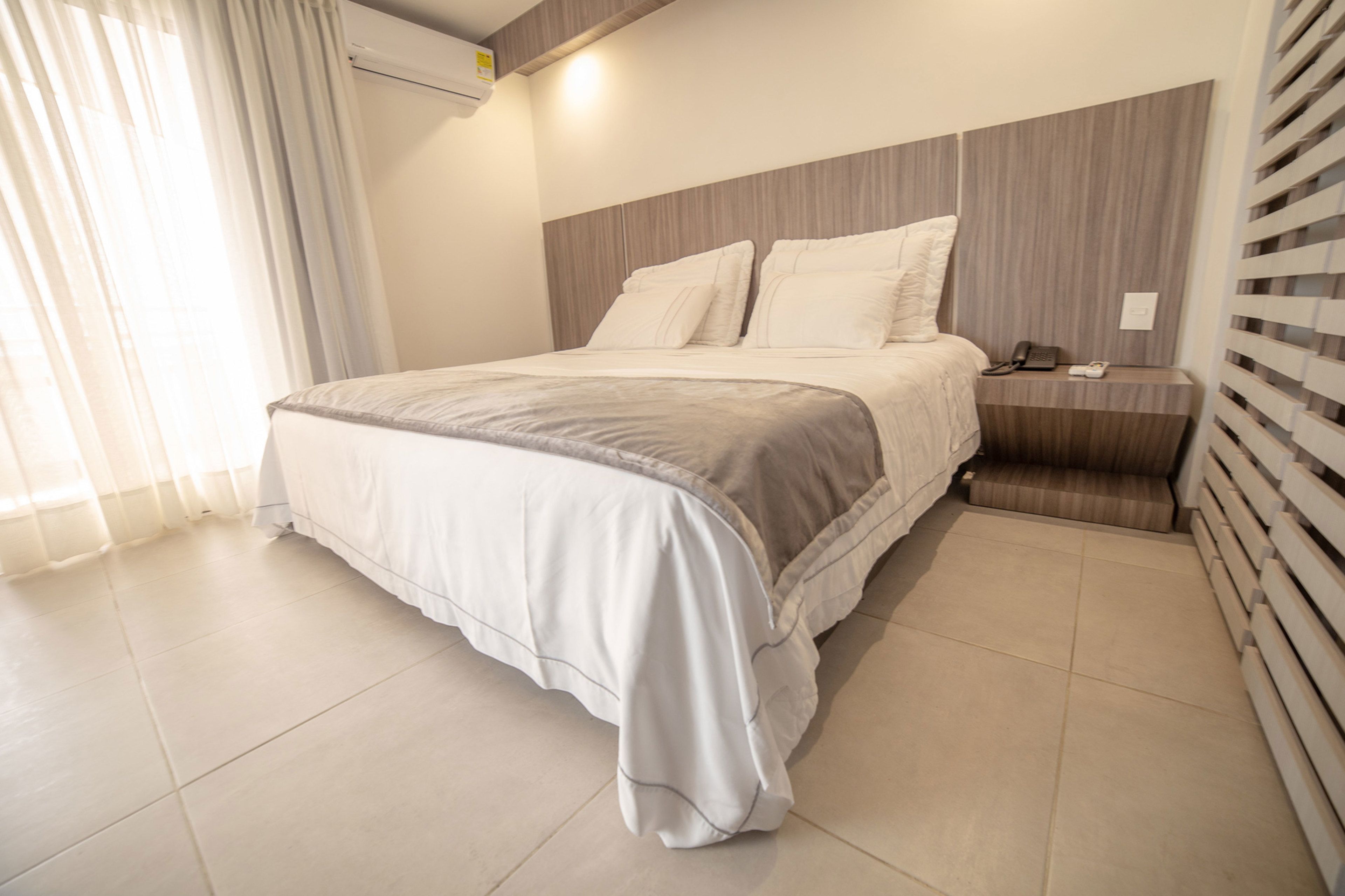 deluxe suite | hypo-allergenic bedding, down duvets, minibar, in-room safe