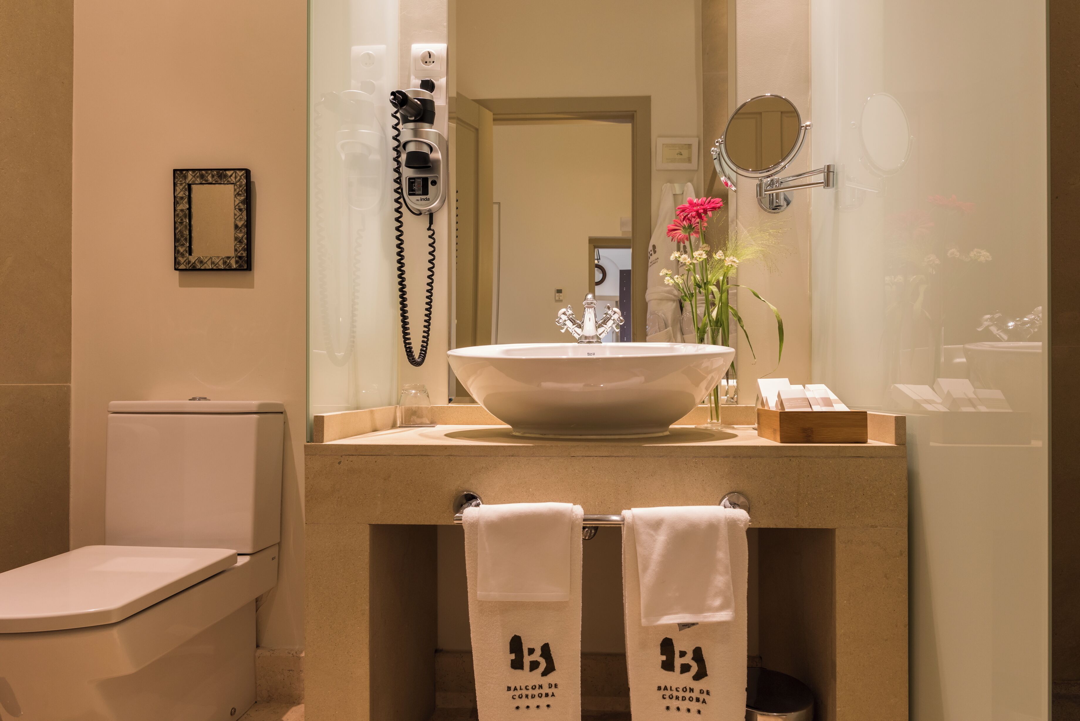 rainfall showerhead, designer toiletries, hair dryer, bathrobes