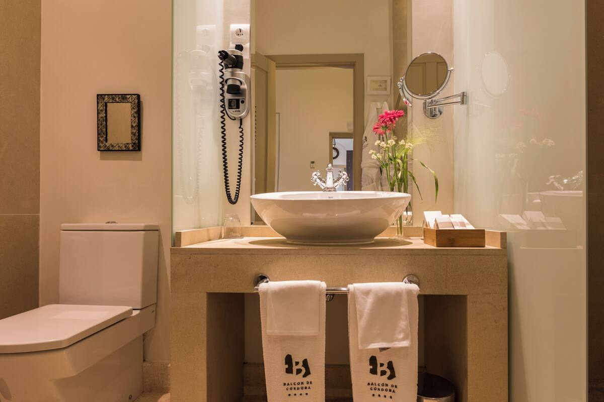 rainfall showerhead, designer toiletries, hair dryer, bathrobes