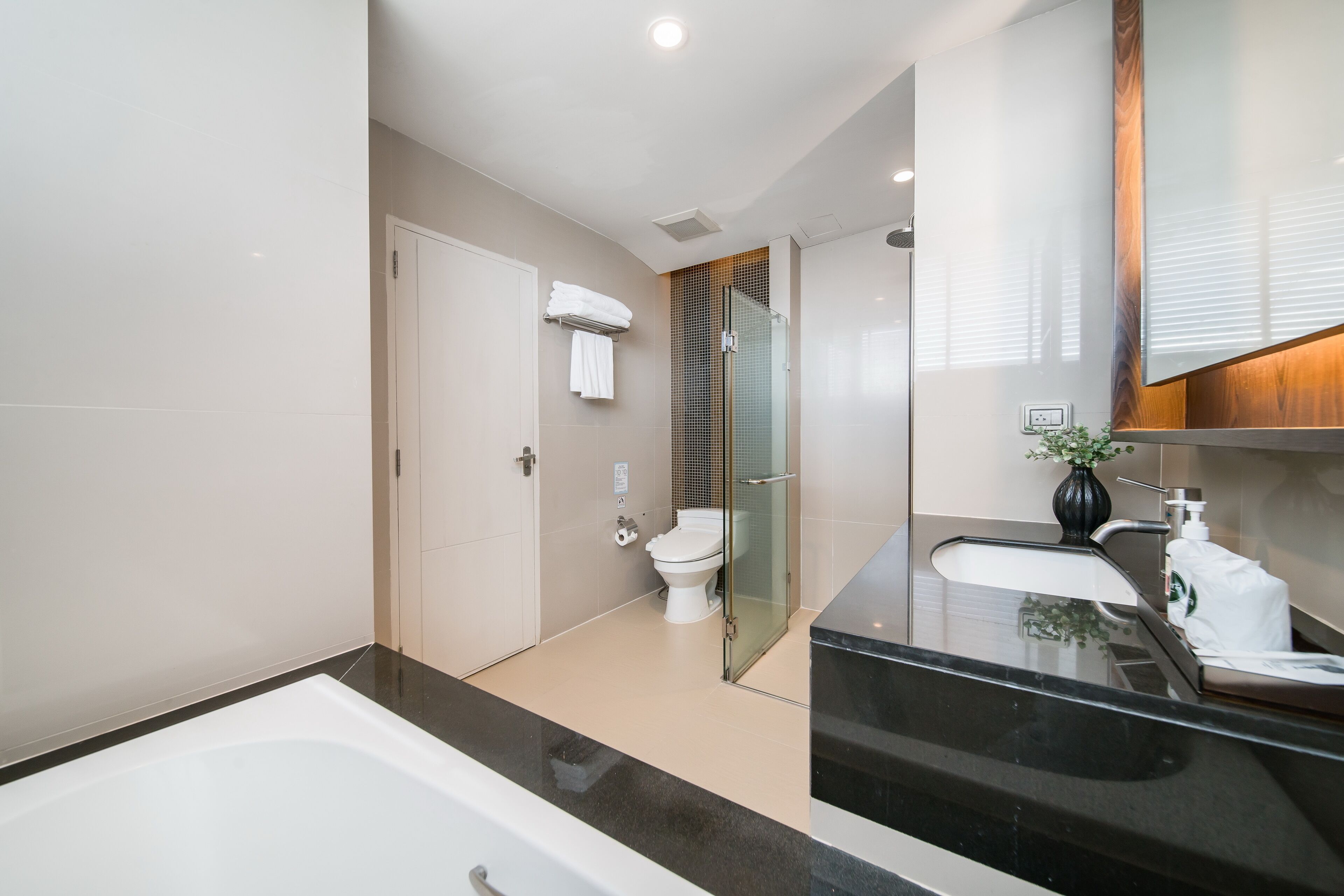 family suite two bedroom with kitchenette | bathroom | shower, rainfall showerhead, free toiletries, hair dryer