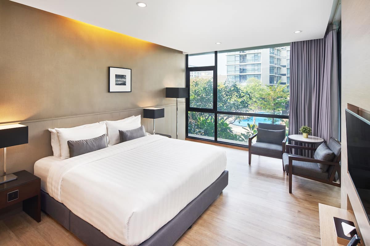 Deluxe Pool View Room with Kitchenette | 1 bedroom, free minibar items, in-room safe, desk