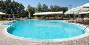 Outdoor pool, open 10:00 AM to 7:00 PM, pool umbrellas, sun loungers