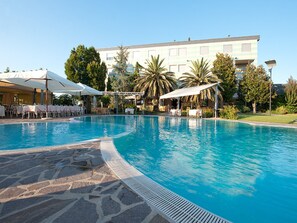 Outdoor pool, open 10:00 AM to 7:00 PM, pool umbrellas, pool loungers