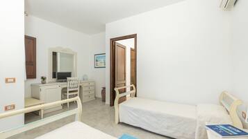 Enjoy a cozy retreat with a single bed, desk, and comfortable seating area.