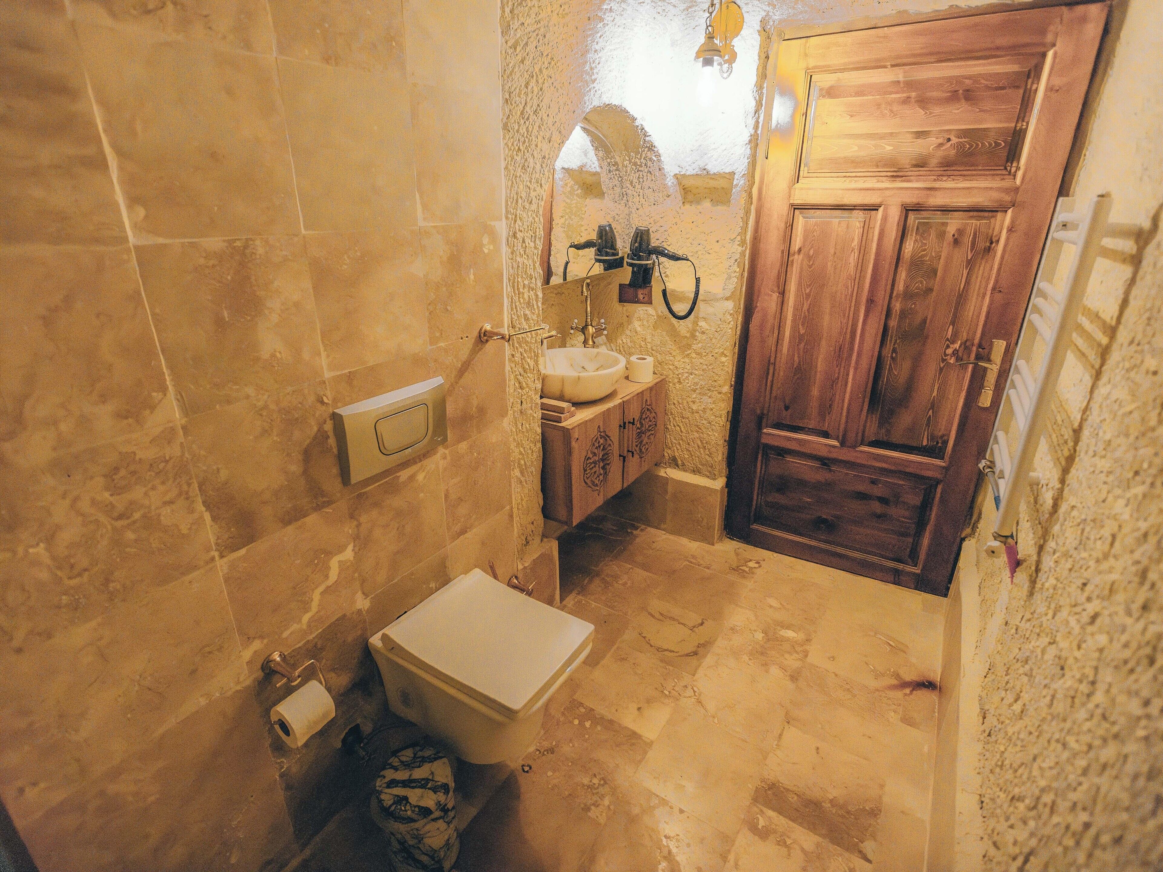 turbel king suite | bathroom | bathtub, rainfall showerhead, eco-friendly toiletries, hair dryer