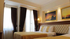 A hotel room with two beds, a large window with curtains, and a painting on the wall. - Hotel Blue Istanbul - Special class (Istanbul)