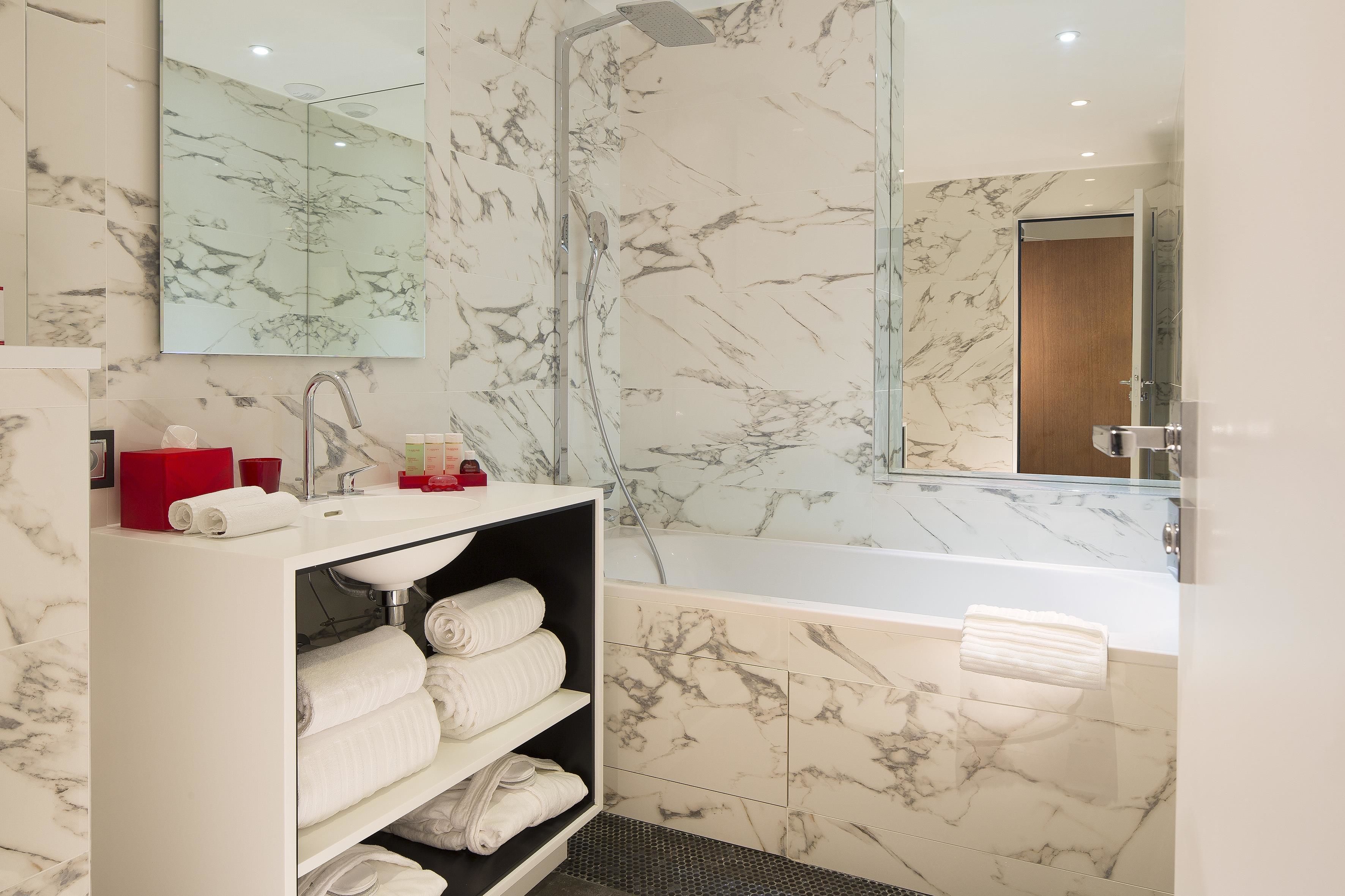 designer toiletries, hair dryer, bathrobes, slippers