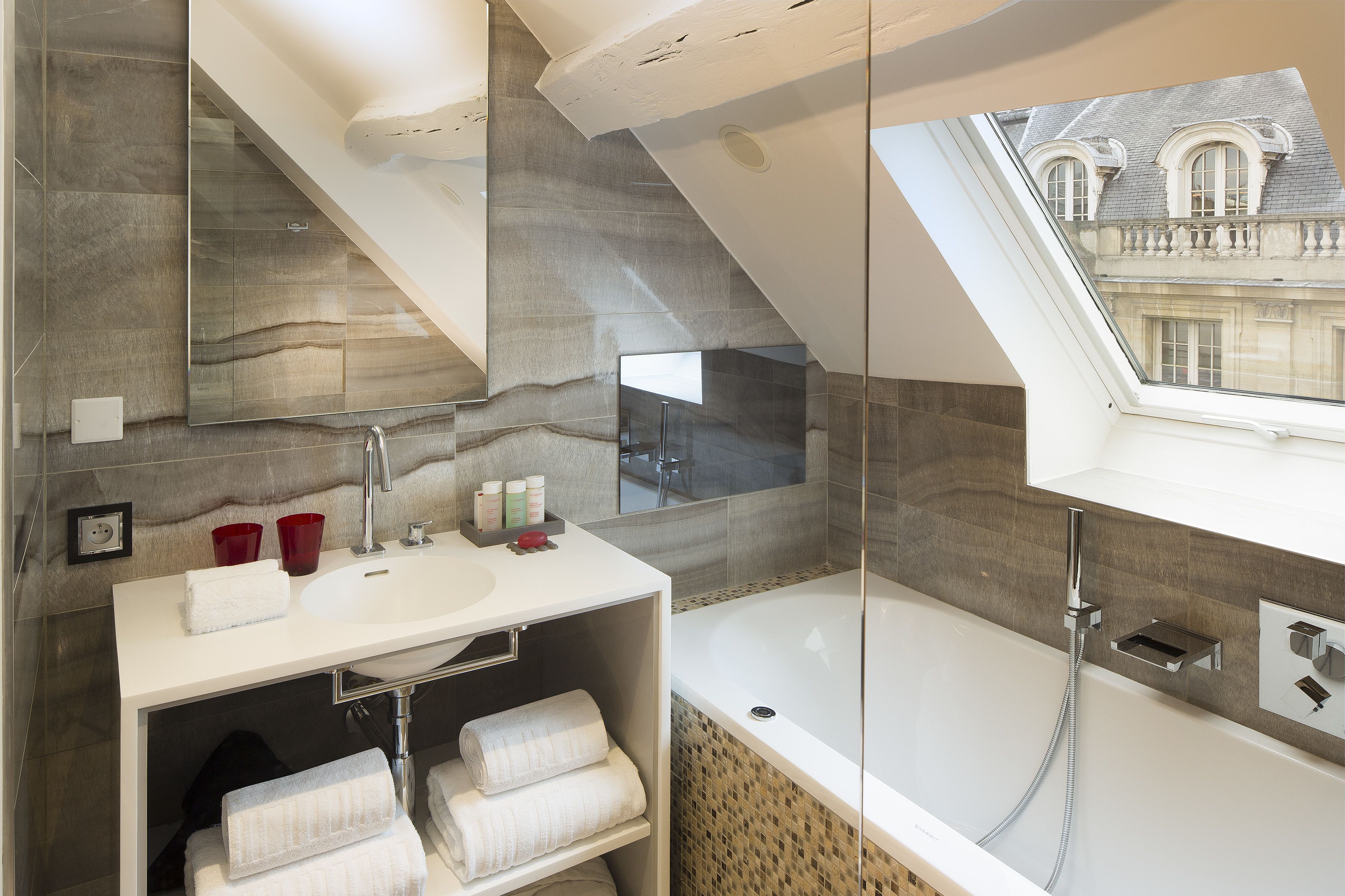 junior suite (triple) | bathroom | designer toiletries, hair dryer, bathrobes, slippers