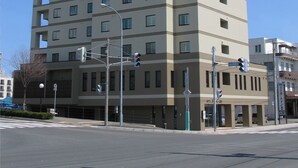A multi-story hotel with a flat facade, numerous windows, and a sign indicating it is a hotel. - Hotel Route Inn Abashiri Ekimae (Abashiri)