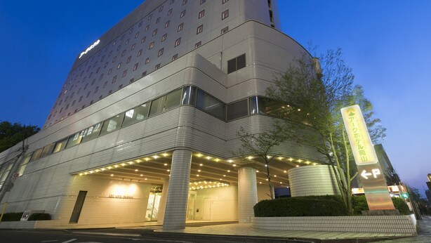 A multi-story hotel with a modern design, featuring a prominent entrance with illuminated signage and a well-lit facade. - Ark Hotel Okayama (Okayama)
