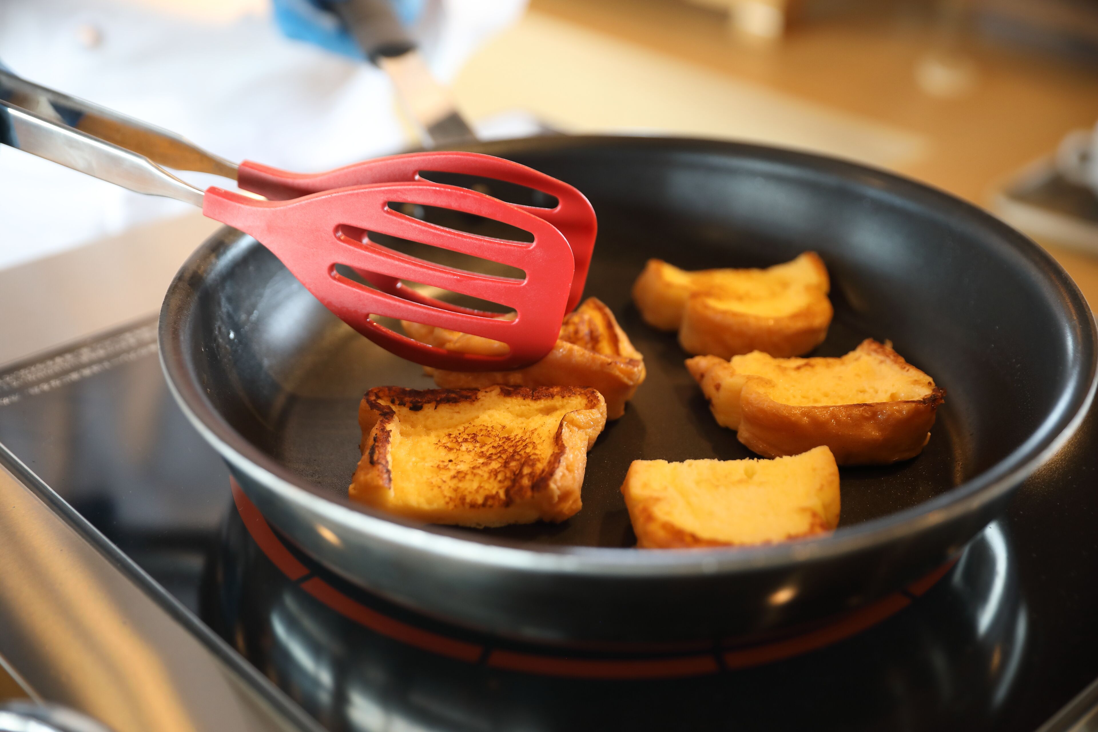 Toasted bread in a pan on a stove.