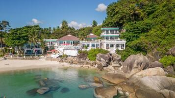 On the beach, white sand, beach towels, beach massages