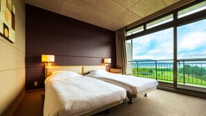 A hotel room with two beds, a large window with a view of a green landscape, and a balcony with a metal railing. - Aso Resort Grandvrio Hotel (Aso)