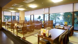 A traditional Japanese-style room with tatami flooring, low tables, and sliding doors. - Route-Inn Grantia Dazaifu (Dazaifu)
