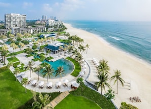 A resort with a pool, beach, and ocean view. - Hyatt Regency Danang Resort and Spa (Da Nang)