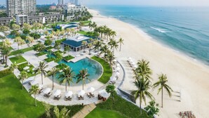 A resort with a pool, beach, and ocean view. - Hyatt Regency Danang Resort and Spa (Da Nang)