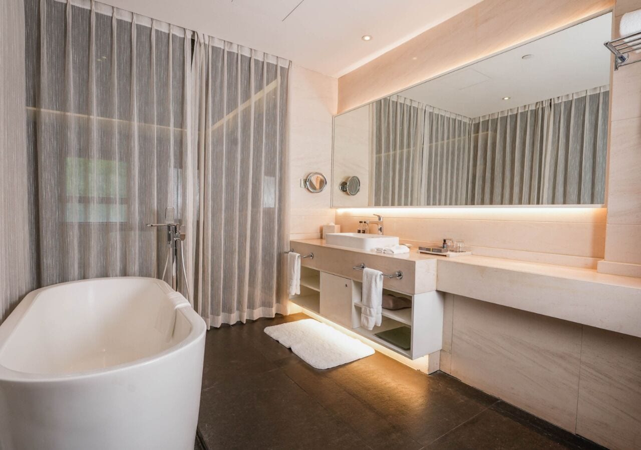 Family Studio Suite, 3 Bedrooms | Bathroom | Rainfall showerhead, slippers, towels