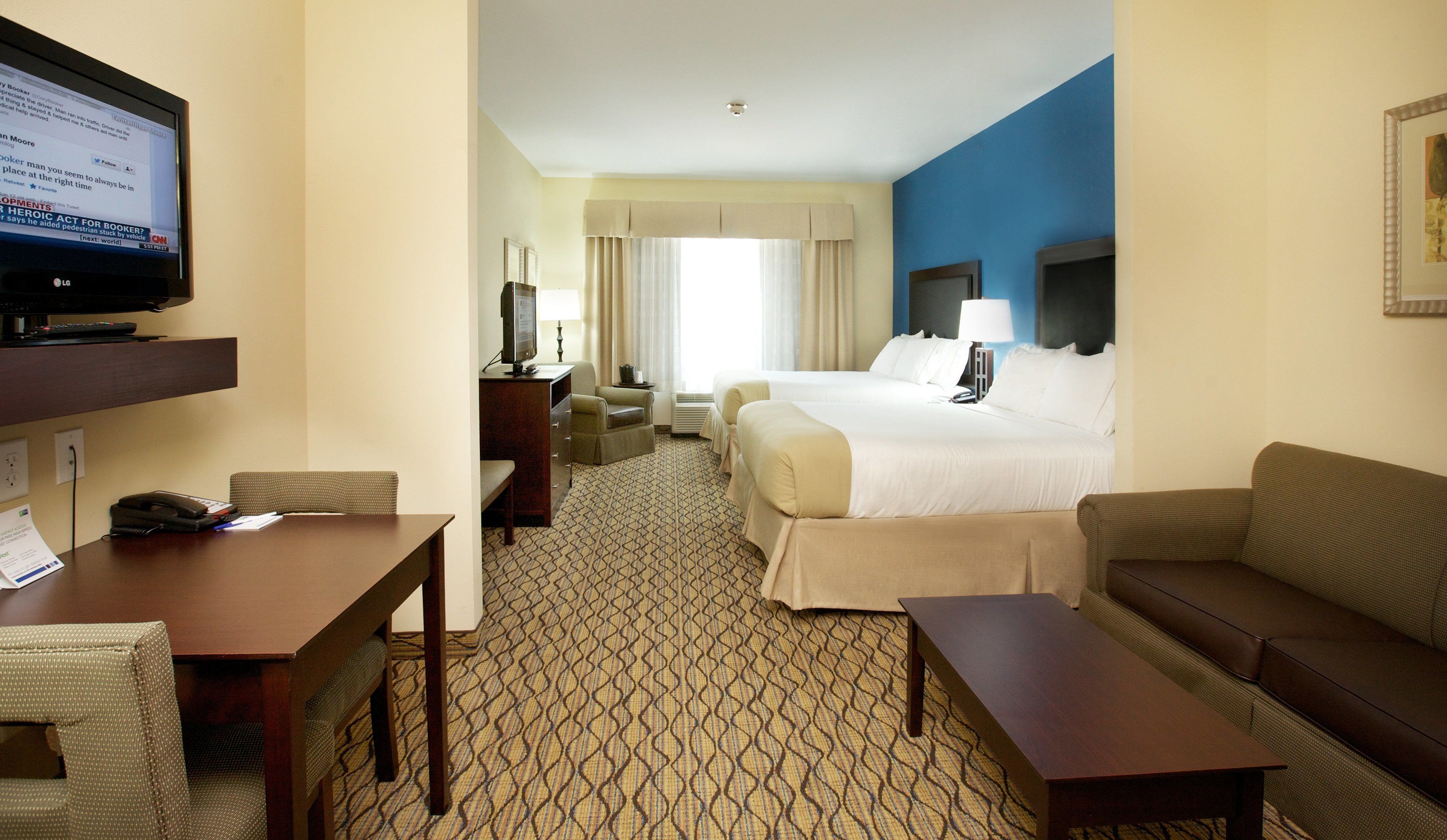 suite, 2 queen beds | in-room safe, desk, iron/ironing board, free cots/infant beds