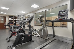 A gym with cardio machines, weight equipment, and a treadmill. - Best Western Plus Brandon Inn (Brandon)