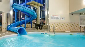 An indoor swimming pool with a blue water slide and a no diving sign. - Best Western Plus Brandon Inn (Brandon)