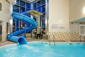 An indoor swimming pool with a blue water slide and a no diving sign. - Best Western Plus Brandon Inn (Brandon)