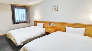 A hotel room with two single beds, a nightstand, a lamp, a window with curtains, and a small picture on the wall. - Hotel Route-Inn Aomori Ekimae (Aomori)