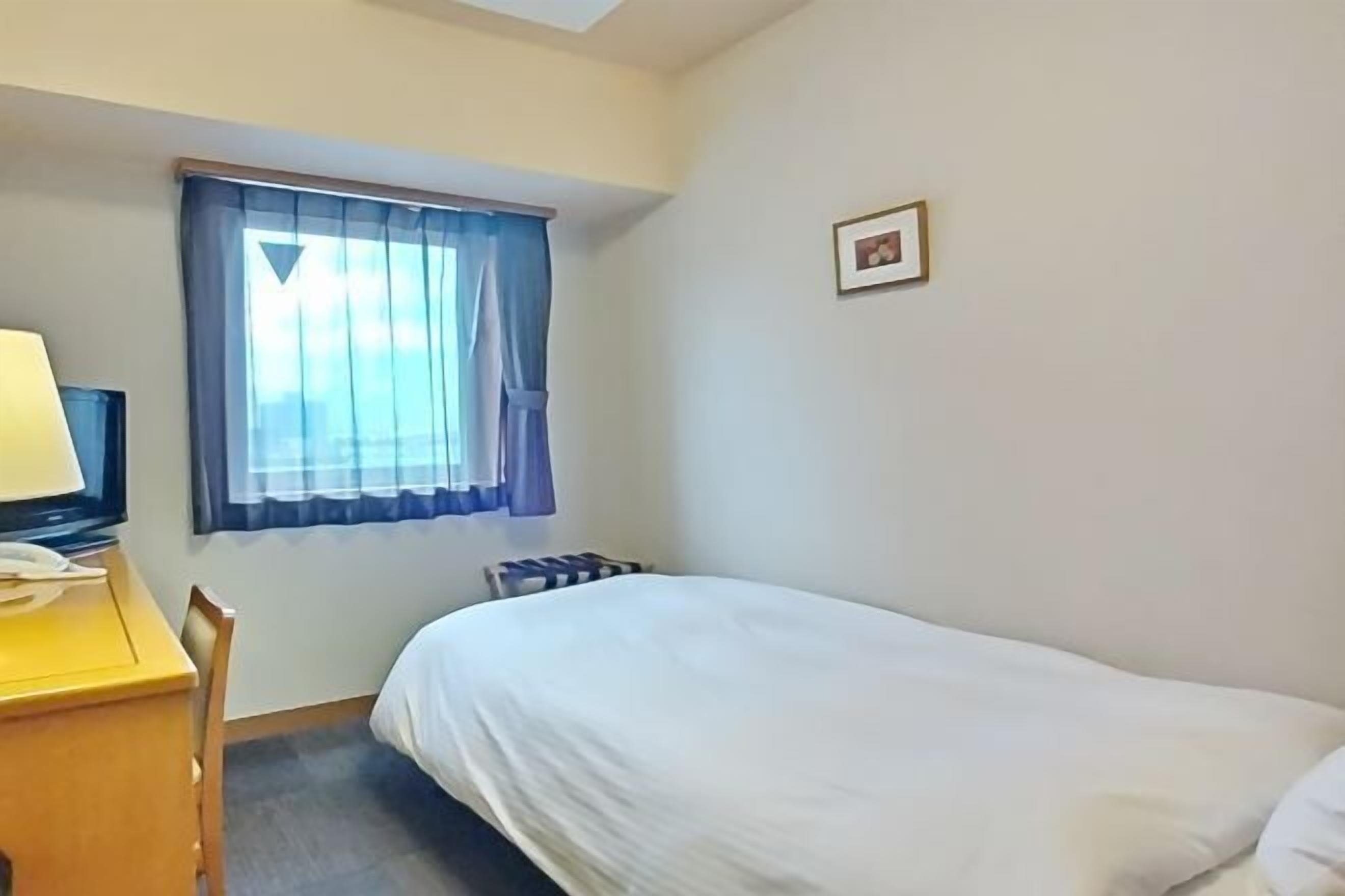 Desk, blackout curtains, free WiFi, bed sheets