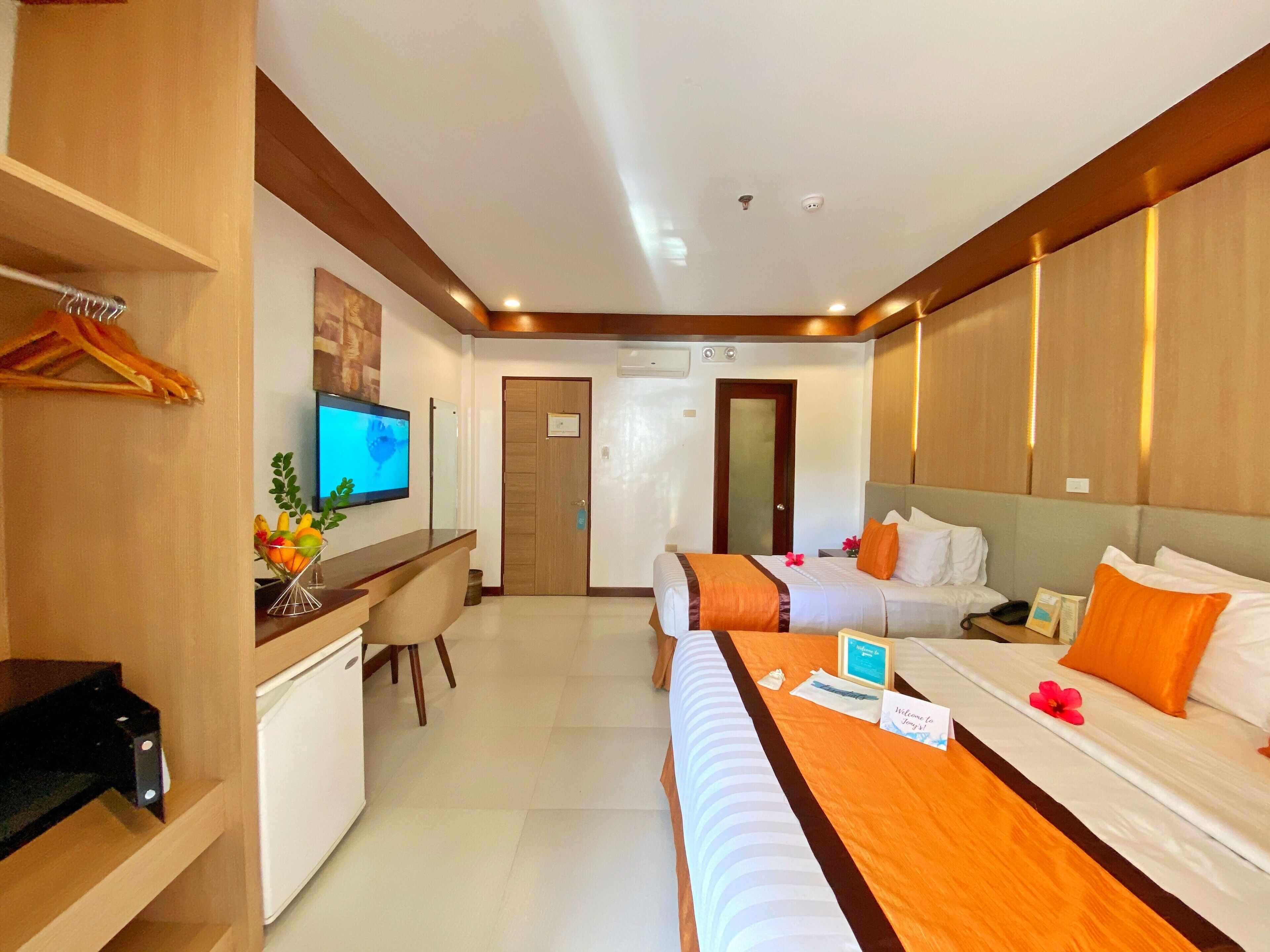 superior triple room | minibar, in-room safe, desk, laptop workspace