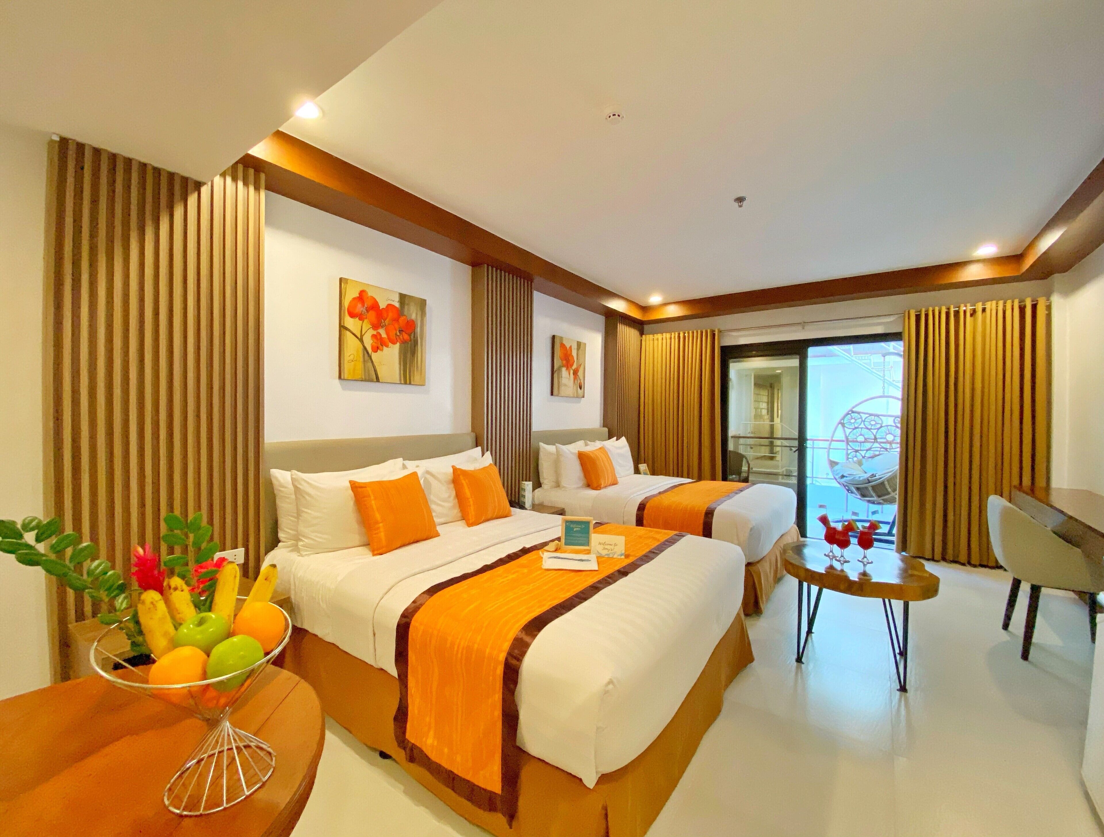 superior quadruple room | minibar, in-room safe, desk, laptop workspace