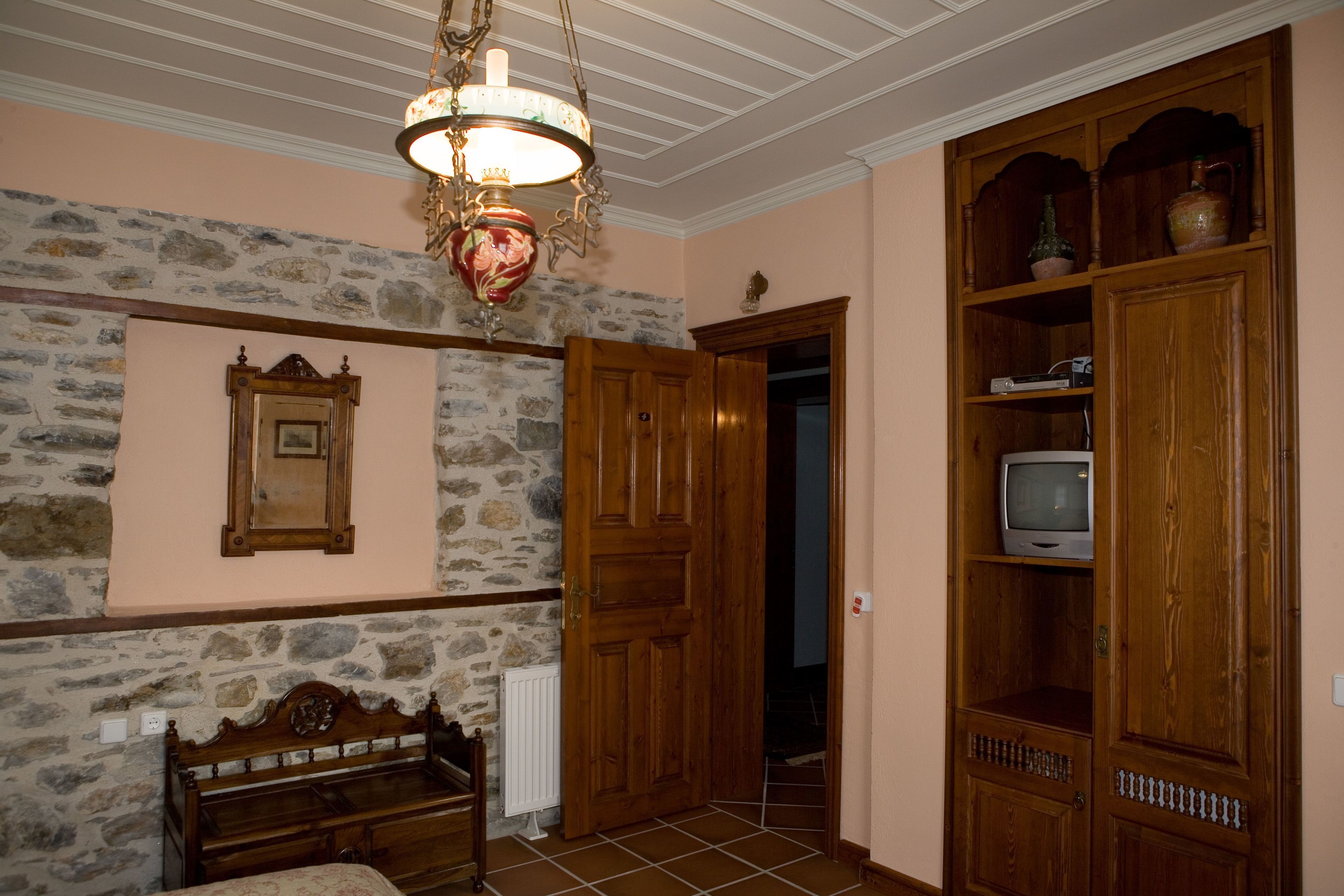 deluxe double room, balcony (erato) | living area | tv