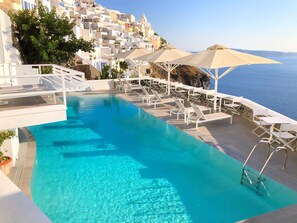 Seasonal outdoor pool, pool umbrellas, pool loungers