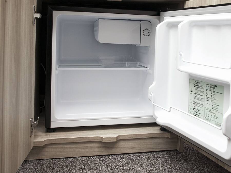 An open refrigerator with a control panel on the right side.