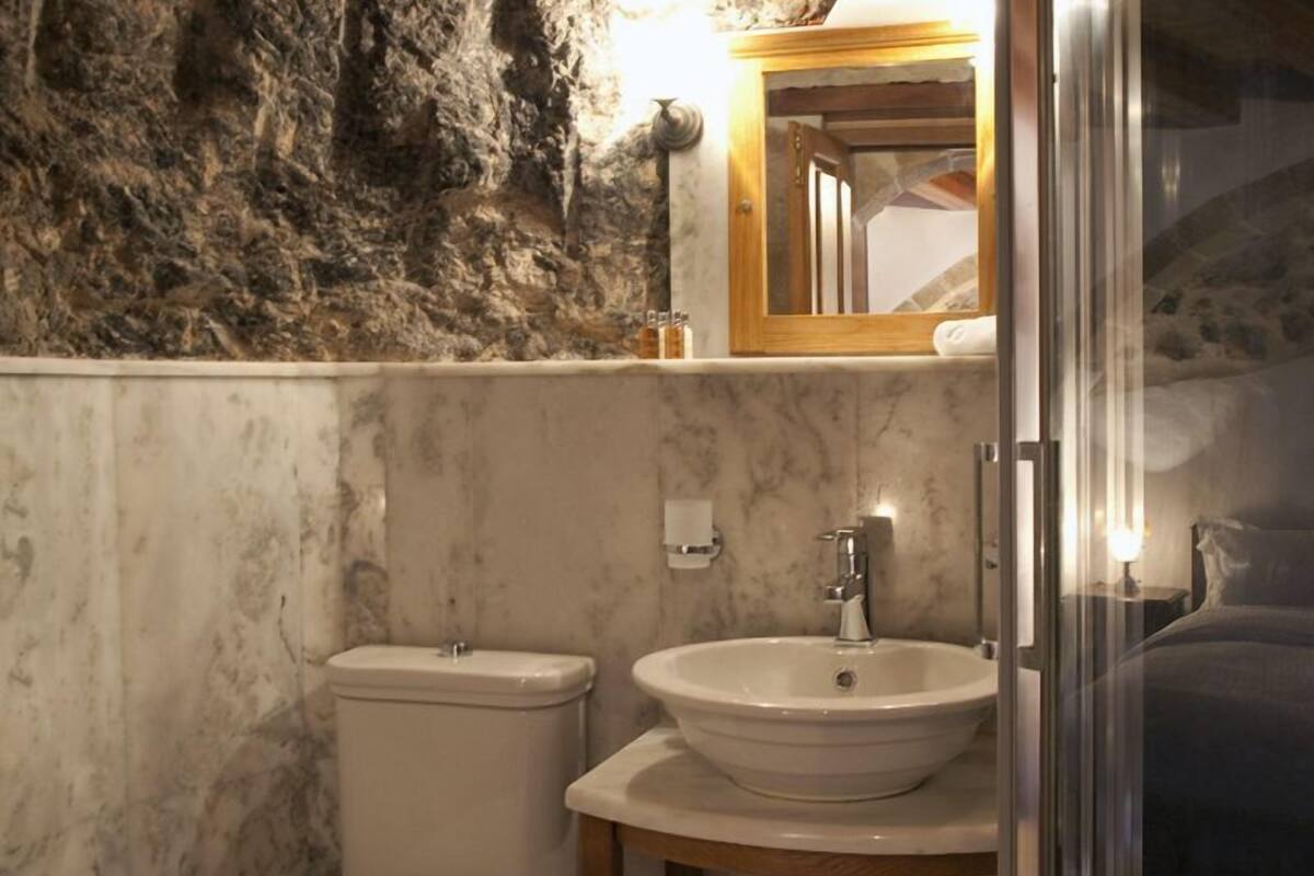 shower, designer toiletries, hair dryer, slippers