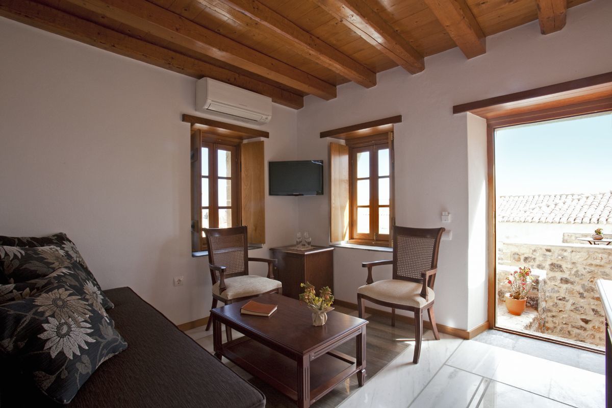 deluxe triple room | living area | tv