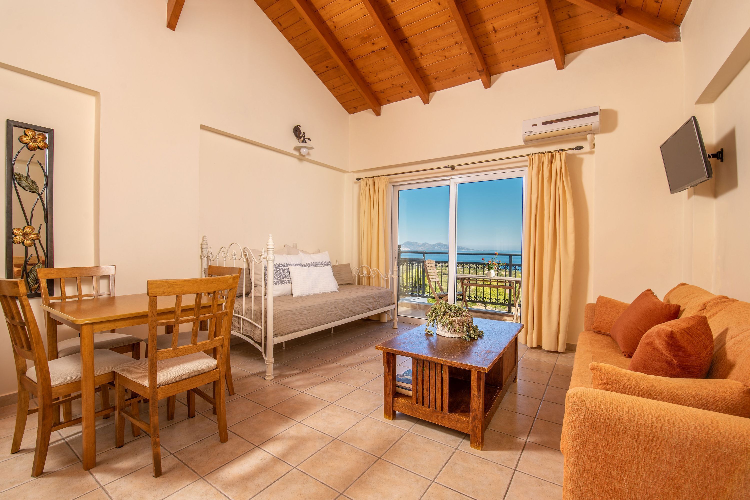 Deluxe Apartment, 1 Bedroom, Balcony | Living area | 32-inch LED TV with digital channels, TV