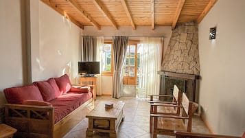 Suite, 1 chambre, vue lac | Coin séjour